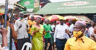 NRM director Nansubuga Sseninde and market leaders strategize on tackling poverty among vendors