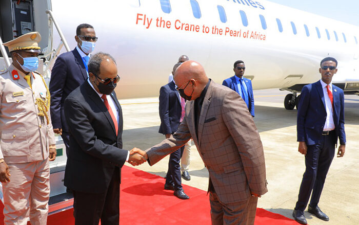 President Hassan Shiekh Mohamud disembarks from Bombardier CRJ at Entebbe Airport.